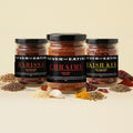 Never Not Eating Bring the Heat Trio: Harissa, Chraime and Turkish Kebab spice jars on a cream table with dried chillies