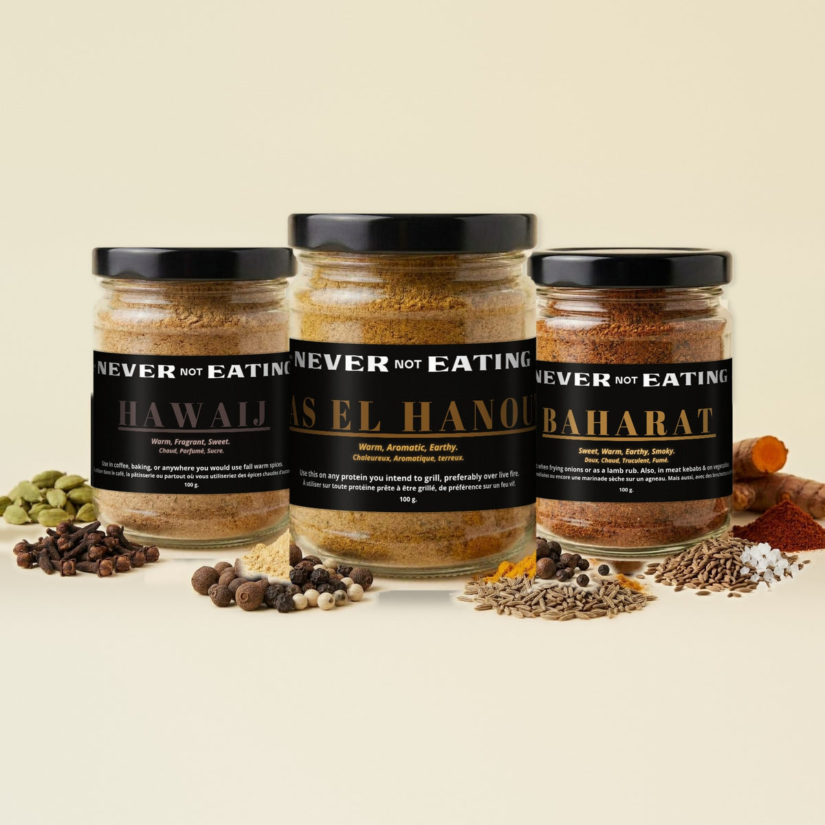 Never Not Eating Cozy Kitchen Trio: Hawaij, Ras el Hanout and Baharat spice jars on a cream table with whole spices