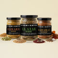 Never Not Eating Fan Favourites Trio: Shawarma, Za'atar and Baharat spice jars on a cream table with whole spices