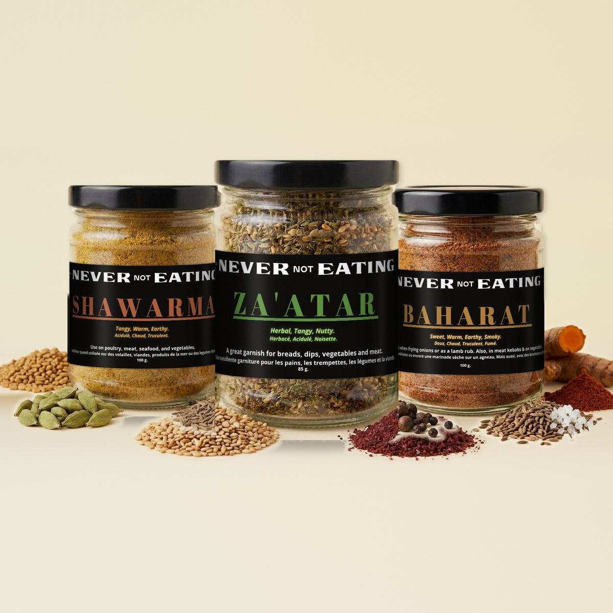 Never Not Eating Fan Favourites Trio: Shawarma, Za'atar and Baharat spice jars on a cream table with whole spices